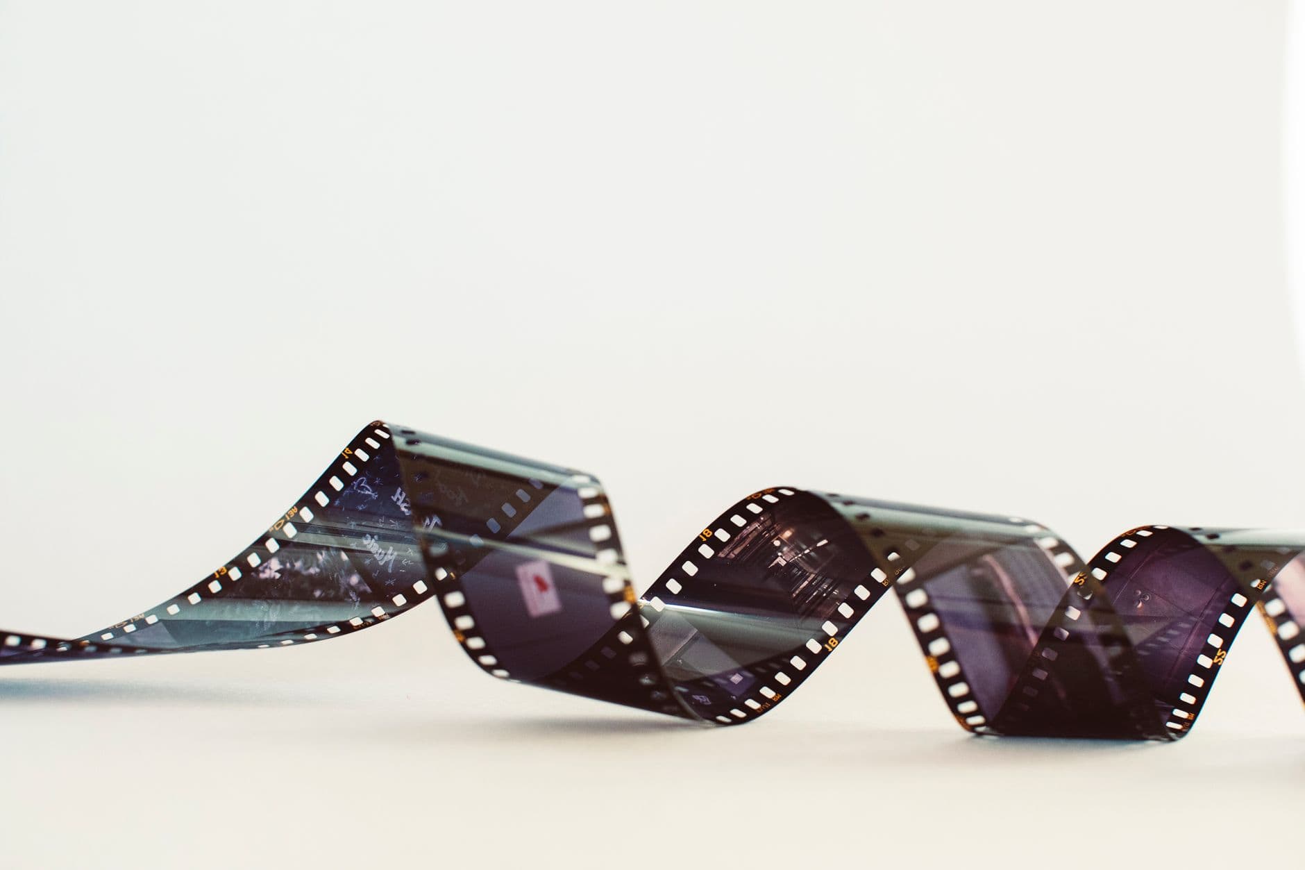 Black-and-white 35 mm film strip in close-up.