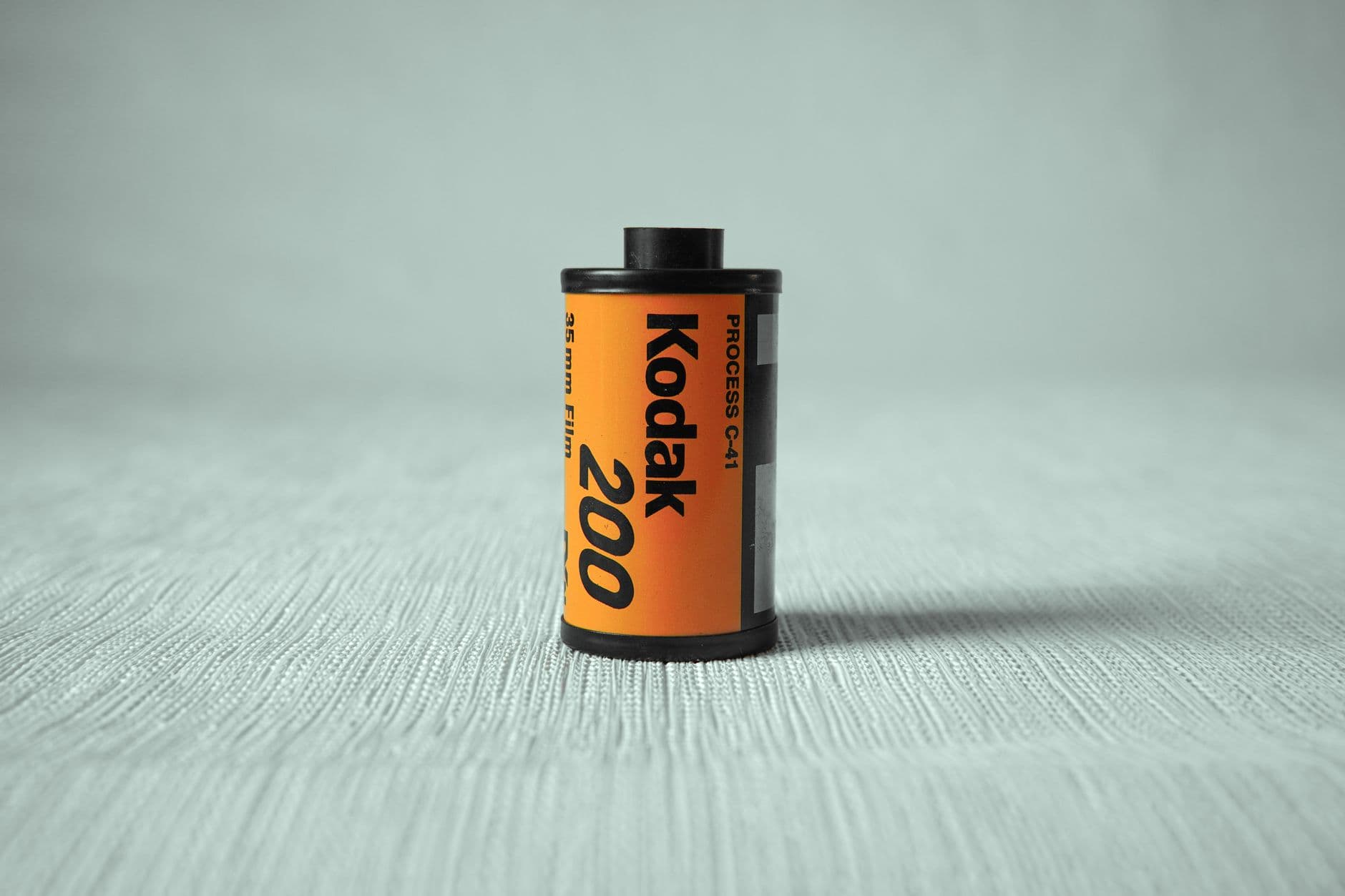 Photography film in an orange container.