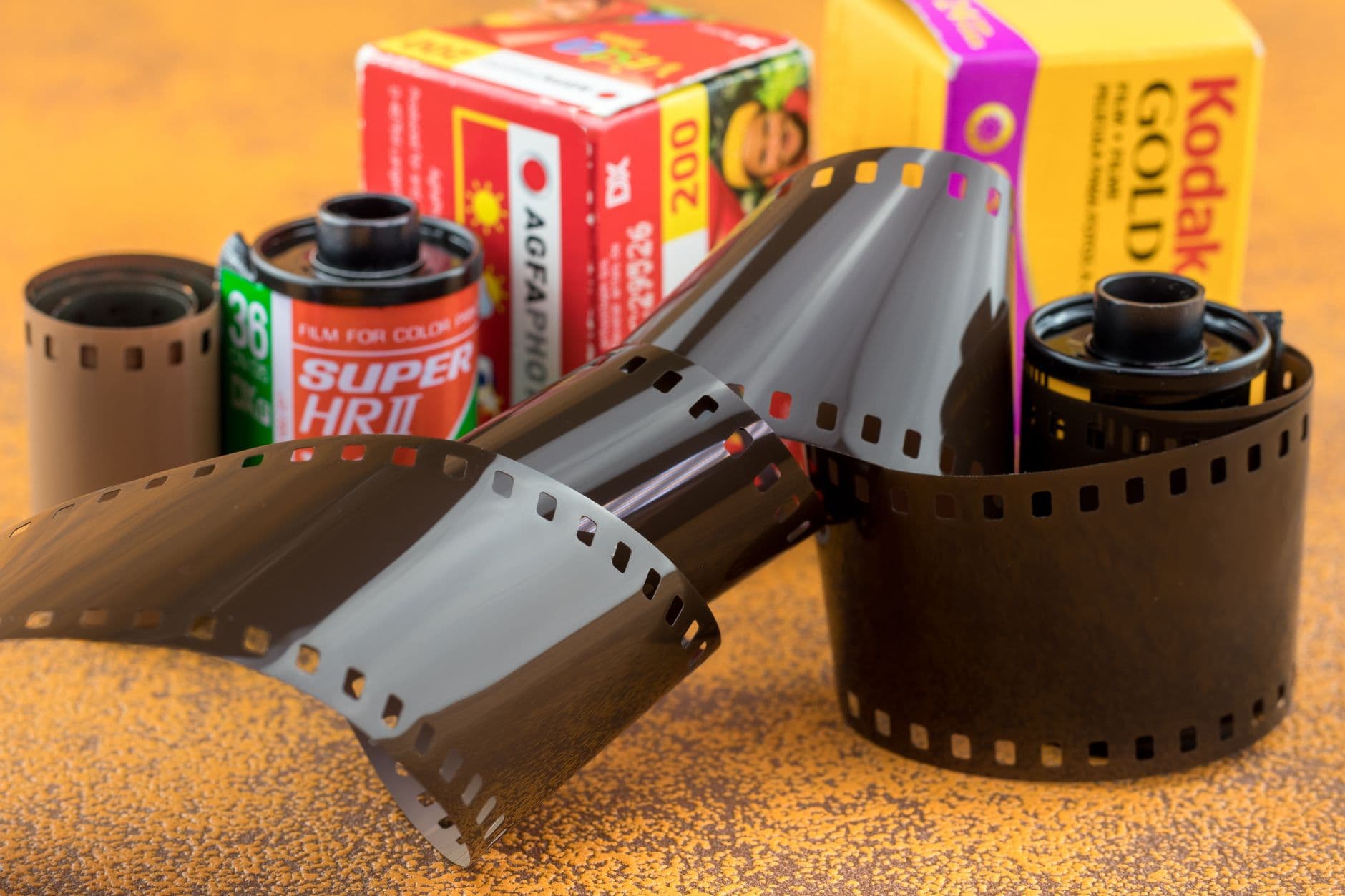 Close-up of vintage film rolls and metal canisters.